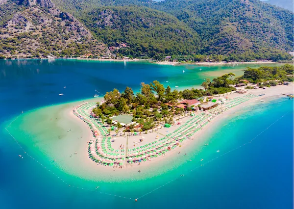 Curved beach and turquoise water near Fethiye on Turkey Greece slow travel tour