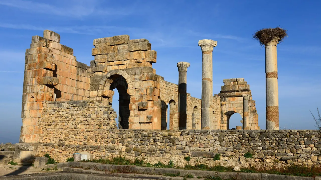Historic Roman ruins of Volubilis showing columns and stone structures in Morocco