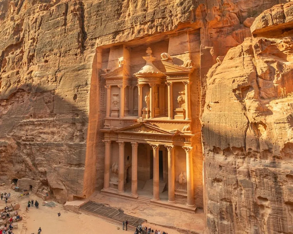 Majestic view of Al-Khazneh, the Treasury of Petra carved into the sandstone cliffs.