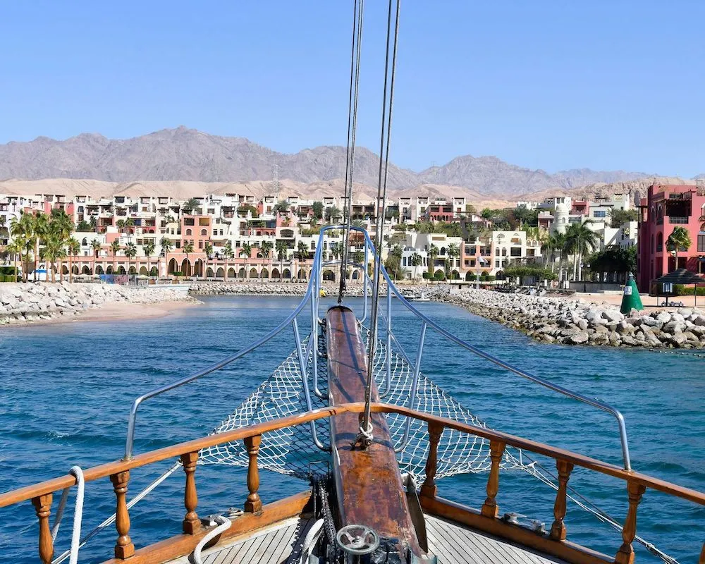 Bow of a sailing boat approaching the shores of Aqaba, Jordan.